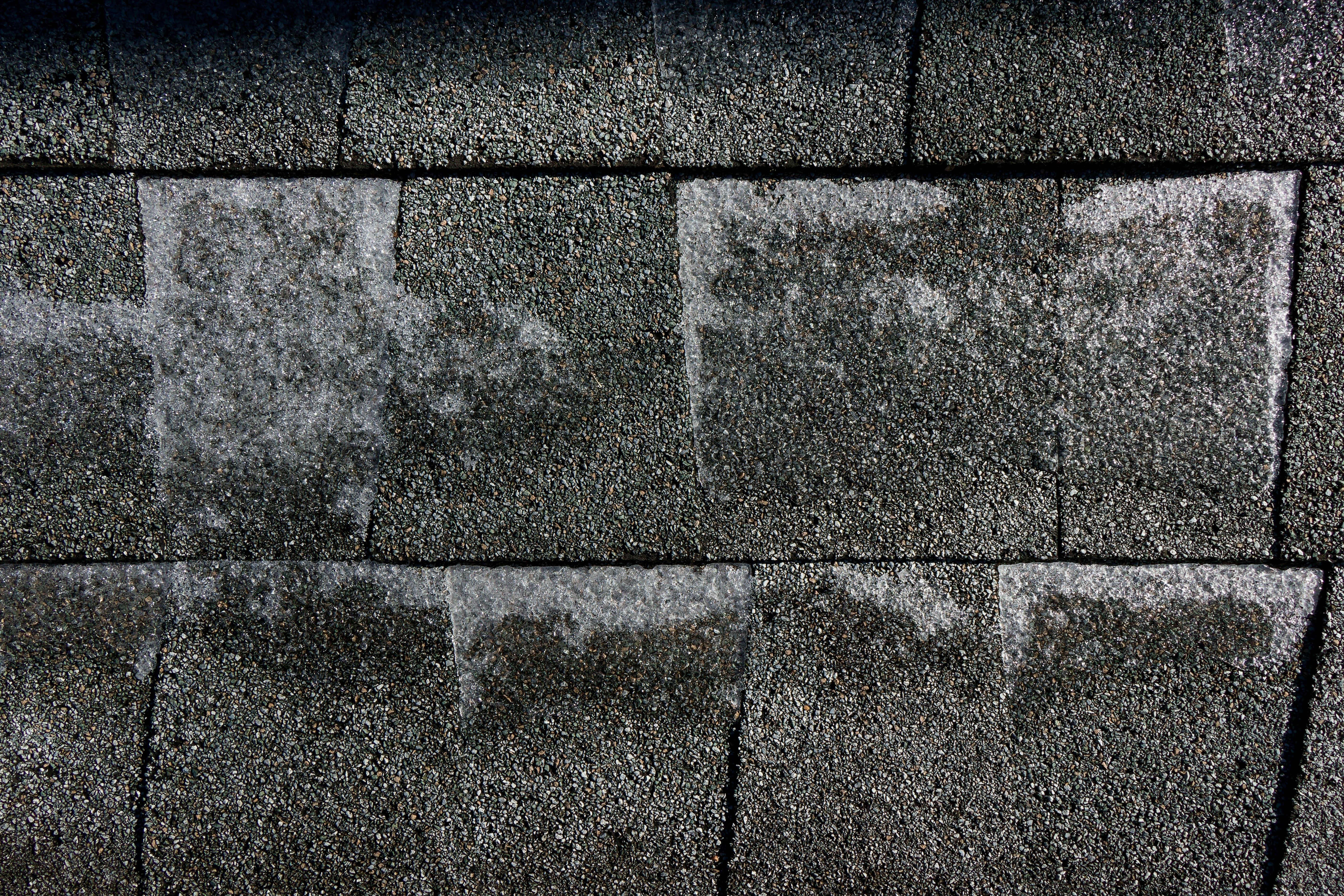 Roof before replacement — storm damage visible