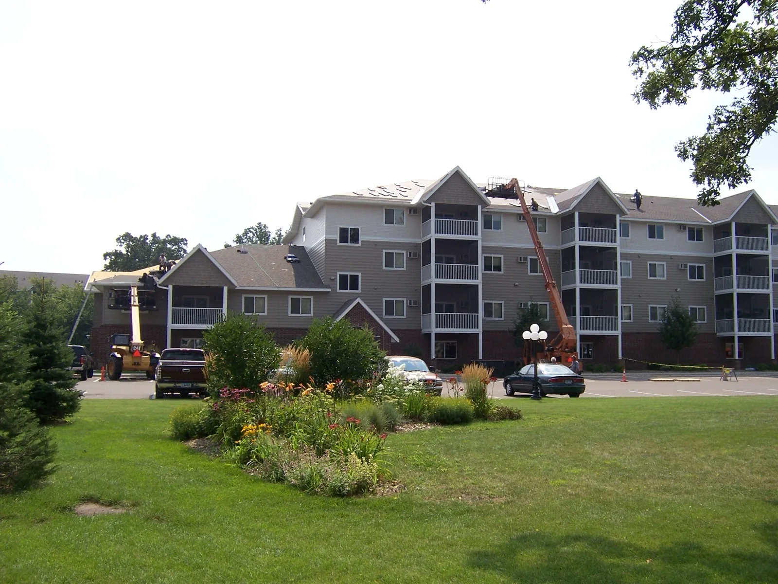 Northern Forge Construction completing multi-unit residential building roof replacement in Blaine, MN. Storm damage restoration and HOA roofing services